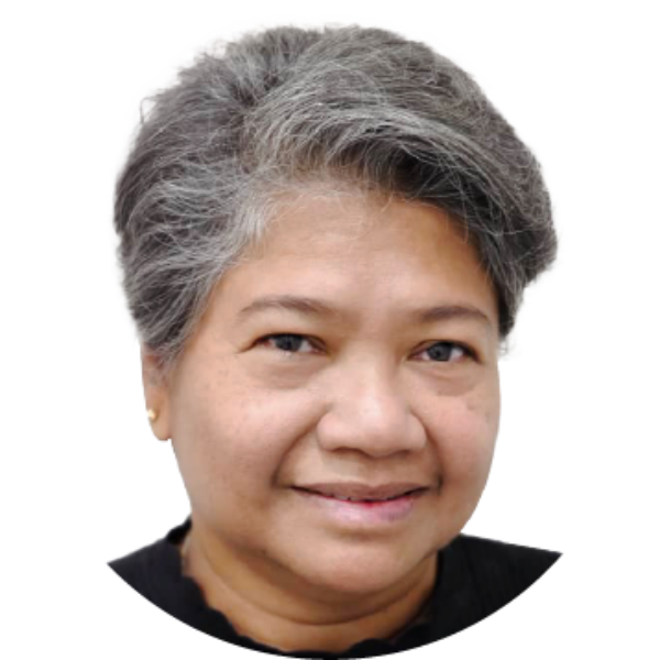 A person with short, gray hair smiles faintly, wearing a black top, perhaps reflecting on their recent home renovation.