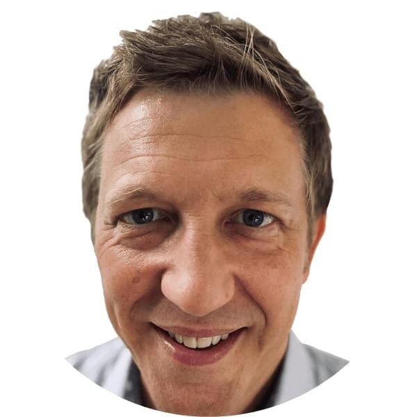 An image of a man smiling in a circle, representing the positive impact of group health insurance on individuals' medical benefits in Singapore.